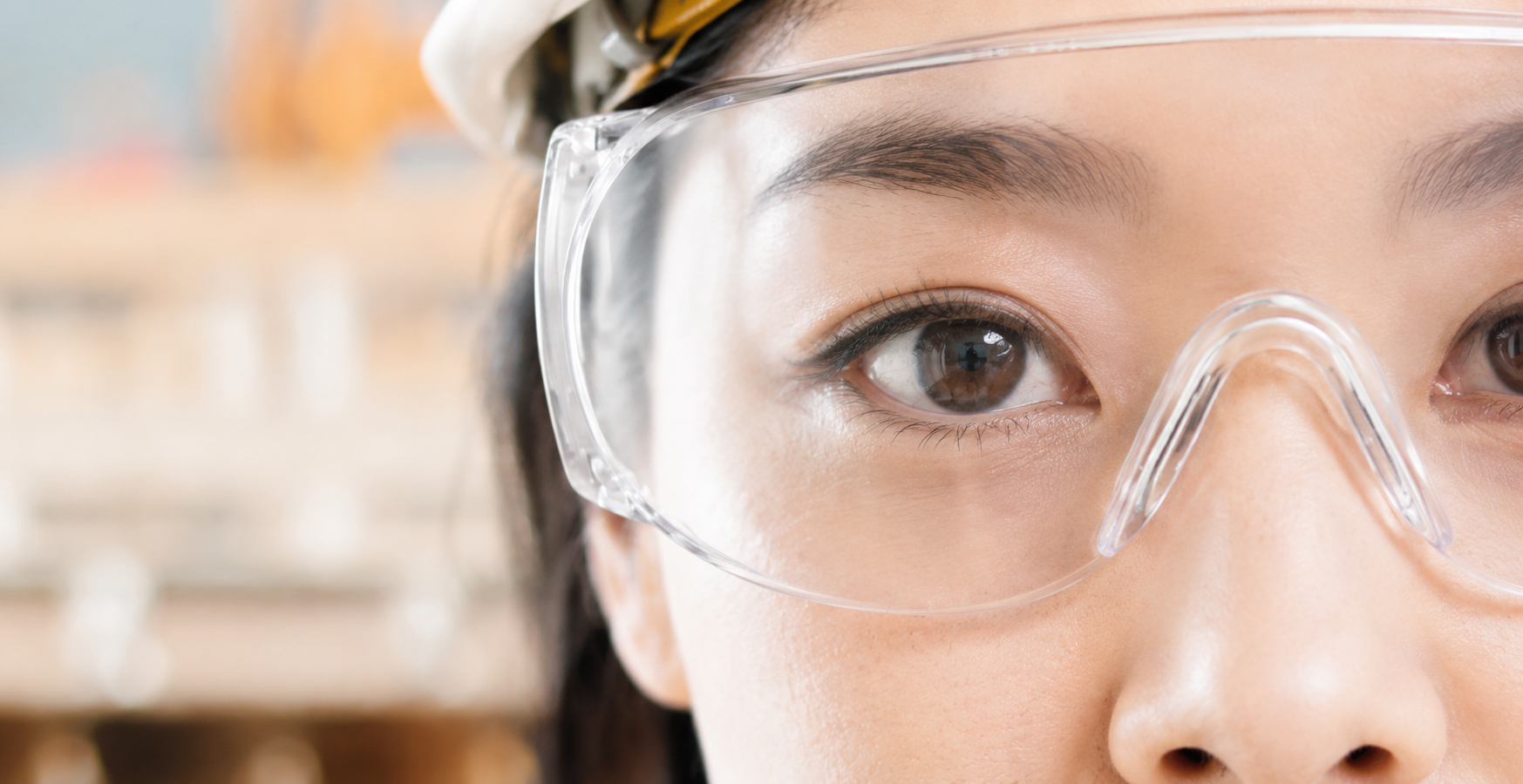 Industrial workplace worker wearing protective safety goggles